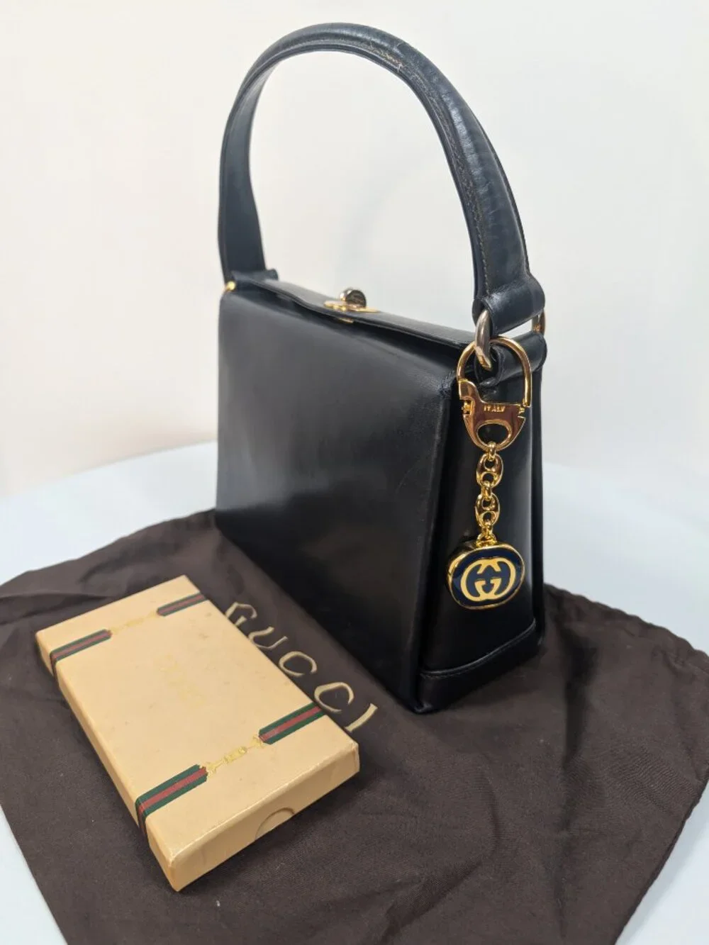 Gucci Vintage Gold Tone GG Logo Embossed Circle Bag Charm